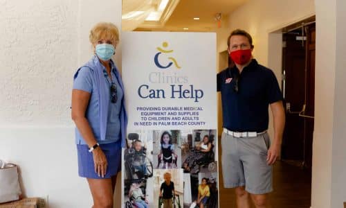 two people standing next to a sign that says Clinics Can Help